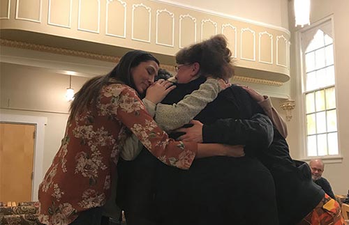 3 Women Hugging and supporting each other